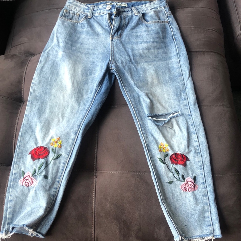 Blue jeans with whimsical embroidery